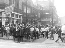 African American men in front of Walgreen Drugs, 1919