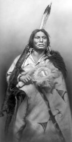 Dakota chief wearing decorated buffalo hide, ca. 1880